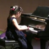 10岁小妹妹王姗姗在加州理工学院春晚舞台上的钢琴独奏令人心醉